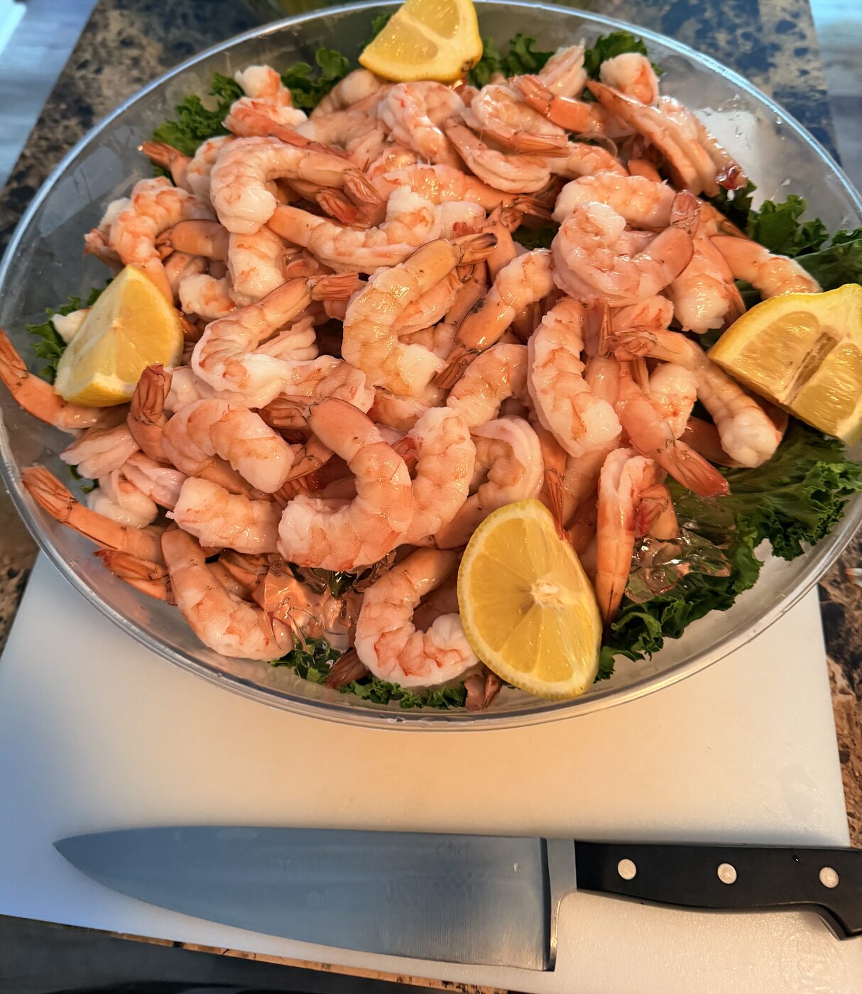 Chilled shrimp cocktail platter with lemon for party catering